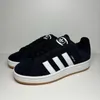 A pair of black Adidas Campus 00S J sneakers with white accents, displayed on a light gray and white background. Voir les images du produit