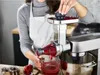 A person is using a Kenwood food processor attachment to juice raspberries. Anteprima dell’immagine prodotto