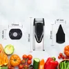 A flat lay image showing a vegetable slicer with dimensions and various vegetables arranged around it. Produktbild-Vorschau