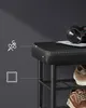 A close-up shot of a black shoe bench with storage shelves, displaying shoes and headphones. Náhled obrázku produktu