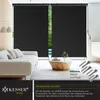 A living room scene with a sofa and a large window covered by black roller blinds. Produktbild-Vorschau