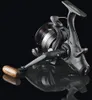 A black fishing reel with a wooden handle is shown against a black background. Podgląd zdjęcia produktu