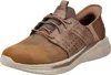 A single brown SKECHERS SLIP-INS SLADE - ZACHARY shoe is shown from a side-front angle against a white background. Voir les images du produit