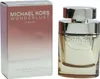 Michael Kors Wonderlust Sublime Eau de Parfum, 100 ml, in goldenem Glasflakon mit glänzender Verschlusskappe, daneben passende Farbverlauf-Verpackung. Produktbild-Vorschau