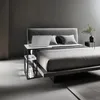 A modern bedroom with a bed and a laptop on a side table. Produktbild-Vorschau