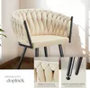 A cream-colored armchair with black legs, shown from the front with close-up insets of the upholstery and leg details. Náhled obrázku produktu