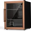 A studio shot of a small black and bronze mini-refrigerator with a glass door. Náhľad obrázku produktu