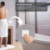 A person in a bathroom is shown next to a mirror and a bathtub, with an arrow pointing to a light switch. Podgląd zdjęcia produktu