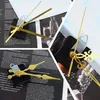 A collage of images showing clock movement mechanisms and clock hands. Produktbild-Vorschau