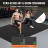 Two people are exercising on a black mat in a gym. Náhled obrázku produktu