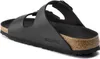 A black Birkenstock sandal is shown from a side-angle on a white background. Produktbild-Vorschau