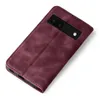 A burgundy flip case for a Google Pixel 6a phone is shown from a diagonal top-down view on a white background. Produktbild-Vorschau