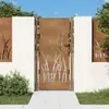 A garden gate with a grass design, set against a white stone wall and green bushes. Produktbild-Vorschau