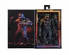 The image shows the front packaging of an action figure, with the figure displayed inside the box on the right side and artwork of the character on the left. Podgląd zdjęcia produktu