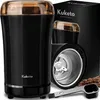 A black Kuketo coffee grinder with a gold lid is shown next to its packaging and some coffee beans. Podgląd zdjęcia produktu