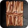 A pile of dog treats arranged on a wooden board. Produktbild-Vorschau