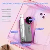 A nail drill set with various attachments, a smartphone, and measurement annotations, presented on a pink and white gradient background. Produktbild-Vorschau