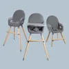 Three grey high chairs with wooden legs are displayed against a light grey background. Anteprima dell’immagine prodotto