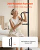 An elderly woman is using a black floor-to-ceiling grab bar in a bedroom setting. Voir les images du produit