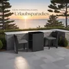 A patio set with chairs and a table is placed on a tiled patio overlooking the ocean at sunset. Náhled obrázku produktu