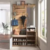 A hallway or entryway with a compact wardrobe set, including a bench, shoe storage, and coat hooks. Produktbild-Vorschau