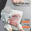 A person wearing gloves is using a commercial electric meat band saw to cut a rack of ribs. The saw has a precise scale for uniform cutting. Anteprima dell’immagine prodotto