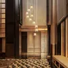 A modern interior hallway with a cascading chandelier. Podgląd zdjęcia produktu