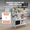 A stainless steel kitchen prep table with items on it, set in a commercial kitchen environment. Text overlays highlight features. Anteprima dell’immagine prodotto
