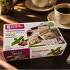 Kandylas Halva Mandel Stevia 400 g mit Kaffeetasse auf Holz Produktbild-Vorschau