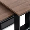 Close-up view of two nesting coffee tables with wooden tops and black metal frames. Náhled obrázku produktu