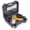 An electric impact wrench and its accessories are displayed inside a black carrying case. Podgląd zdjęcia produktu