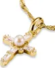 A close-up shot of a gold cross pendant with a pearl and clear stones, attached to a gold chain. Voir les images du produit