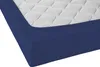 A close-up view of a blue fitted sheet on a mattress. Produktbild-Vorschau