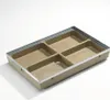 A rectangular, multi-compartment tray with a metal trim, shown against a white background. Produktbild-Vorschau
