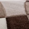 A close-up view of a textured rug with a geometric pattern. Produktbild-Vorschau