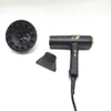 A black hairdryer with gold accents and accessories is laid out on a white background. Podgląd zdjęcia produktu