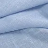 A close-up view of light blue fabric with a linen-like texture, showing folds and creases. Produktbild-Vorschau