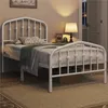A white metal bed frame with a mattress and bedding is shown in a bedroom setting. Produktbild-Vorschau