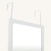 A white over-the-door mirror with two hooks for hanging. Anteprima dell’immagine prodotto