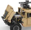 A close-up view of a tan-colored Lego-style model of a Humvee with its hood open, revealing the engine. Produktbild-Vorschau