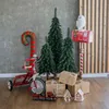 A festive Christmas scene with decorative trees, gifts, and toys. Náhled obrázku produktu