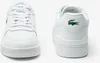 A pair of white Lacoste sneakers shown from the front and back. Náhľad obrázku produktu
