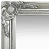 A close-up view of the ornate corner of a silver baroque-style mirror frame. Produktbild-Vorschau