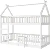 A white wooden bunk bed with a house-shaped frame, a ladder, and a small door. Voir les images du produit