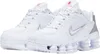 A pair of white Nike Shox TL sneakers. Voir les images du produit