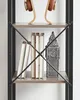 A close-up view of a bookshelf with books and a decorative Big Ben clock. Náhľad obrázku produktu