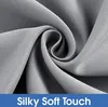 A close-up of gray fabric with a swirl pattern, indicating a soft texture. Voir les images du produit