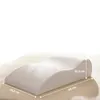 A white orthopedic pillow for leg elevation is shown on a light beige surface. Produktbild-Vorschau