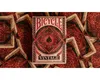 A deck of Bicycle Vintage playing cards is shown on a background of scattered playing cards with a vintage pattern. Produktbild-Vorschau