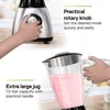 A blender with a hand turning the knob and another hand holding the jug. Produktbild-Vorschau